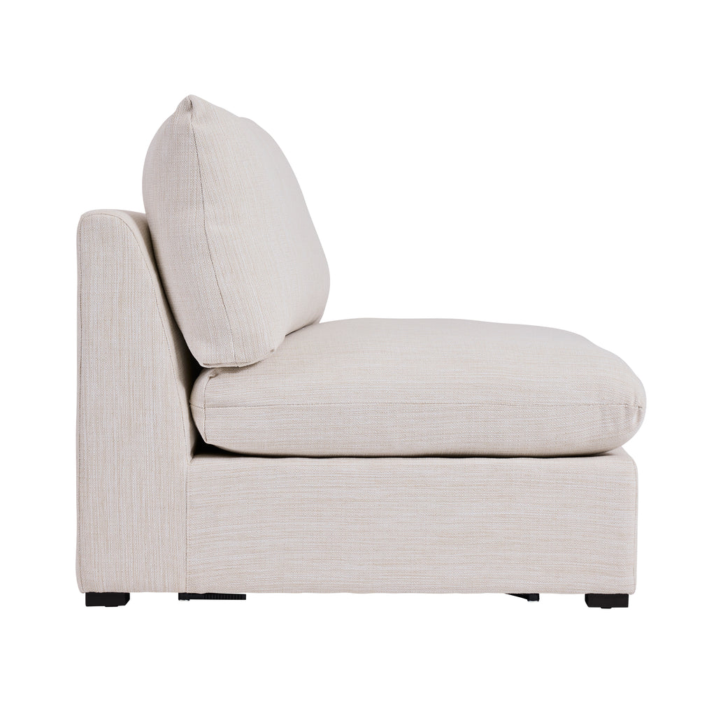 Side view of a cream colored armless sectional piece