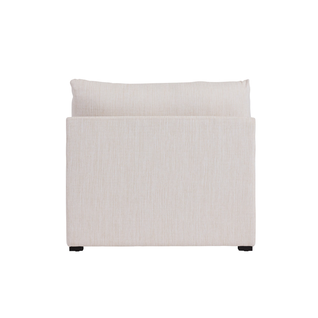Back view of a cream colored armless sectional piece