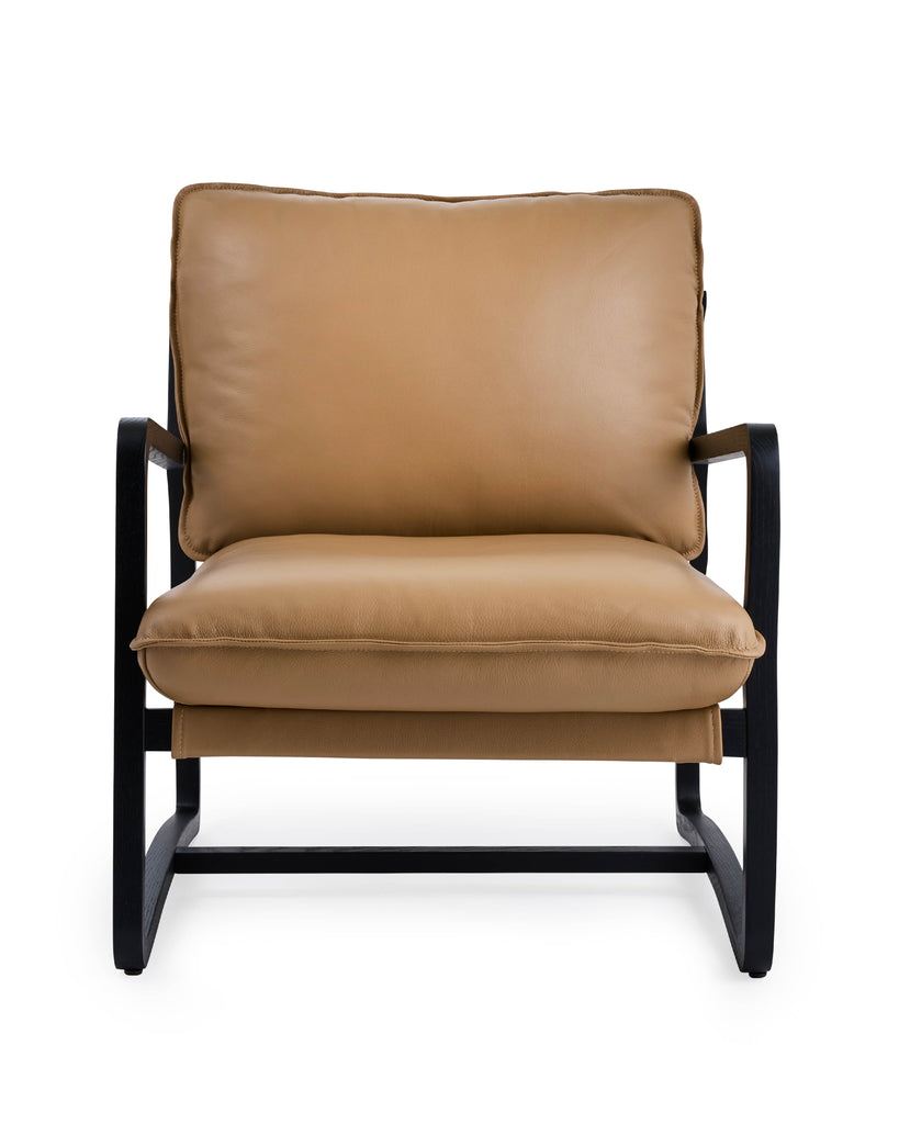 Romy leather chair in camel colored leather and black arms
